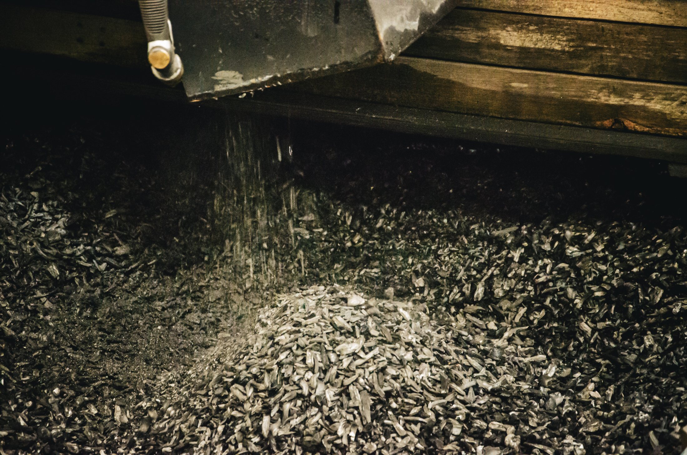 Biochar material moving through the production discharge system
