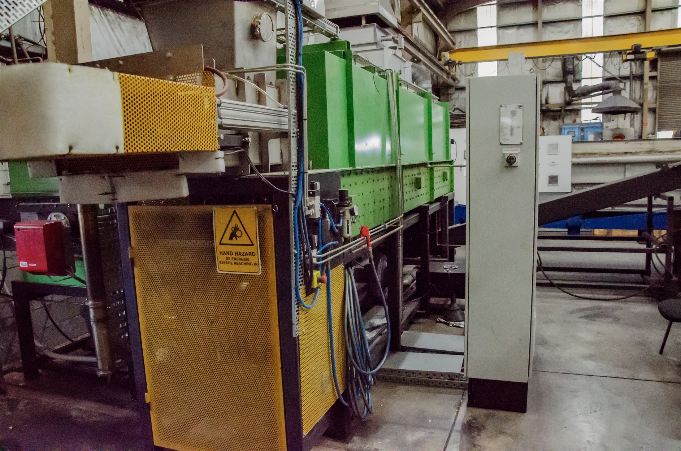 Industrial biochar production line with guarded processing equipment