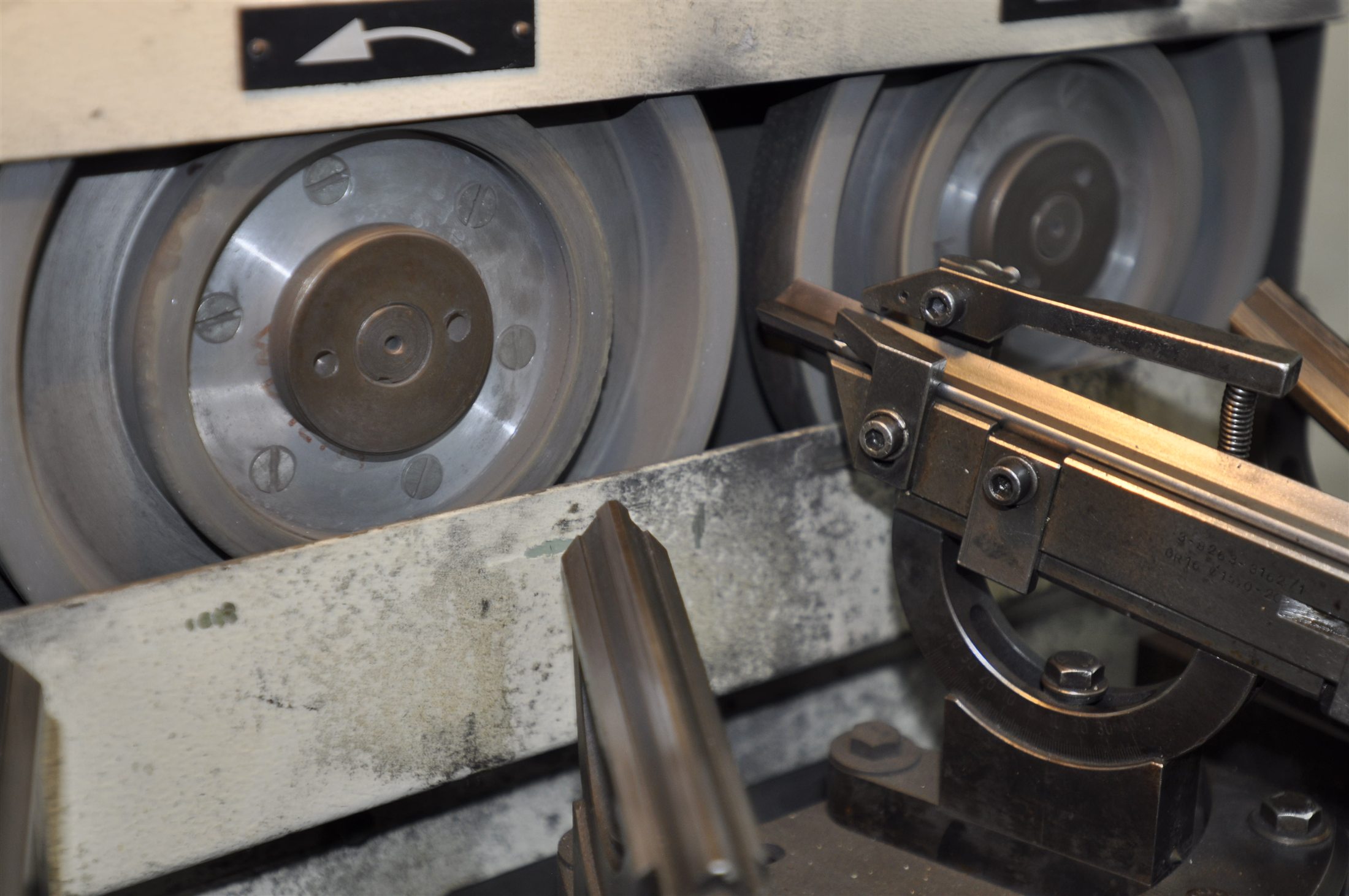 Specialist drilling tool being prepared on workshop grinding equipment