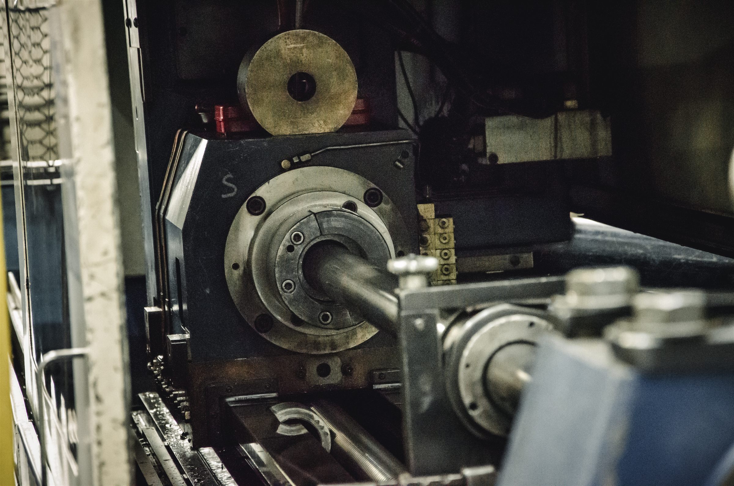 Close-up of a precision boring spindle operating inside the DHDS workshop