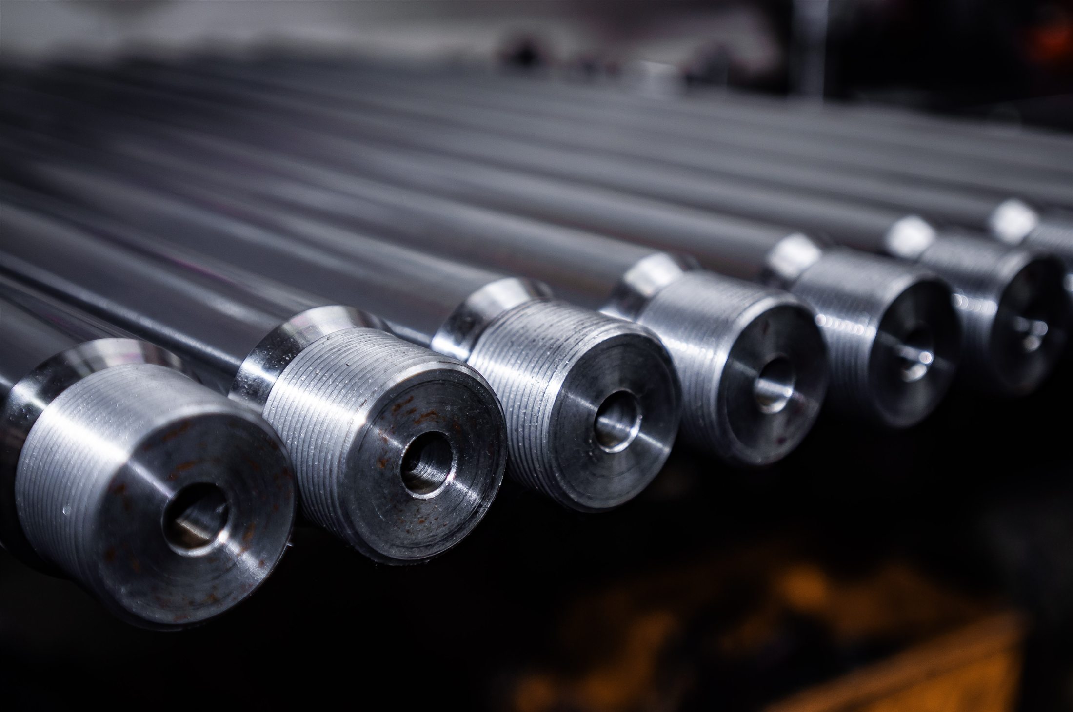 Long precision-machined components with deep gun-drilled bores